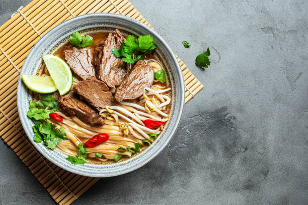 istock Pho Bo Vietnamese soup with rice noodle and beef 2174469311