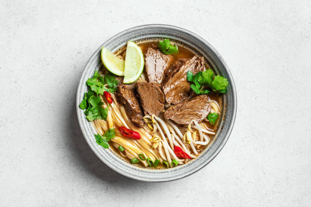istock Pho Bo Vietnamese soup with rice noodle and beef 2174469315