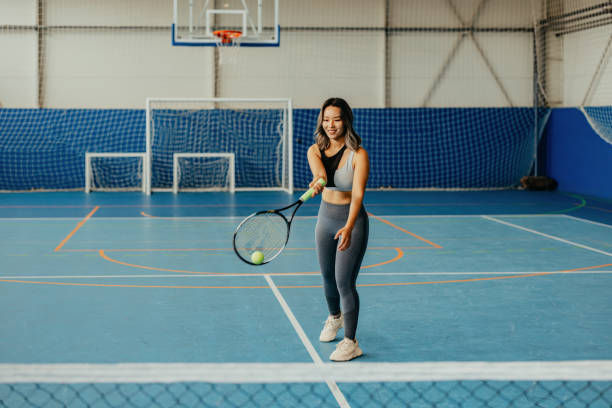 istock Female tennis player preparing for serve 2174469342