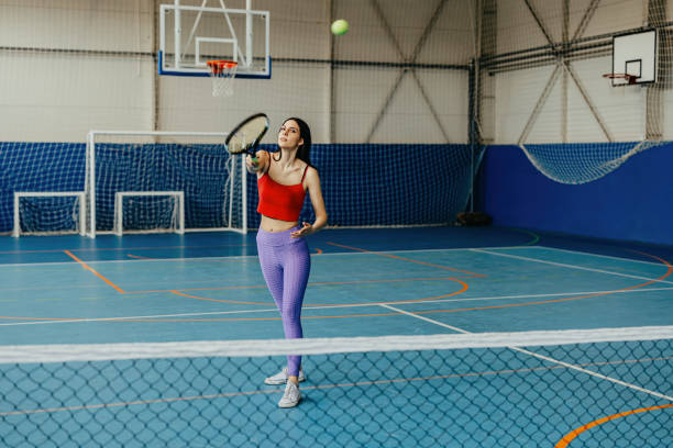istock Focused tennis player mid-game on court 2174469702