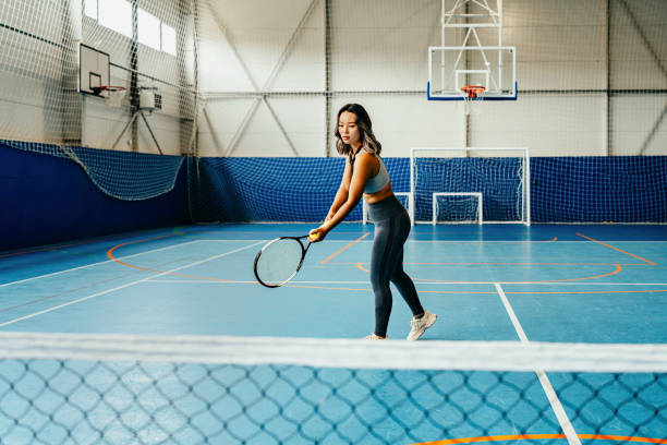 Focused female tennis player with racket
