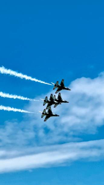 istock Jets flying in a blue sky with white clouds 2174471619