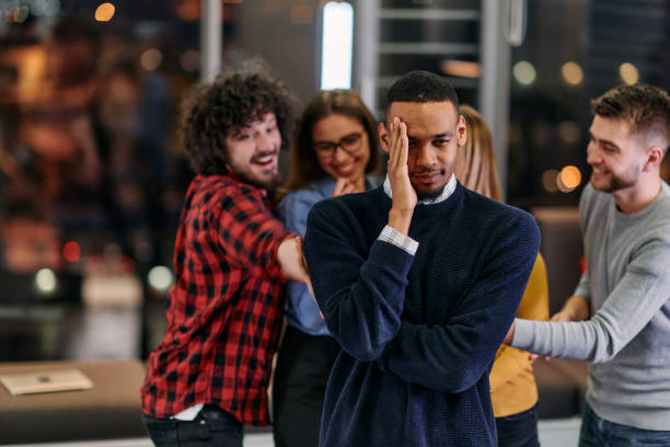 istock A group of young business people have fun playing interesting games while taking a break from work in a modern office. Selective focus 2174475545