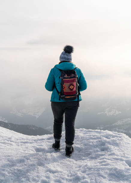 istock A woman with a backpack with an ornament on her back 2174477355