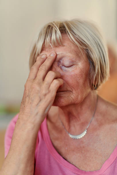 istock Senior Woman Practicing Calming Traditional Exercises with a Gentle Forehead Gesture 2174479500