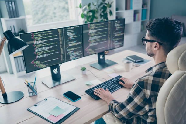 istock Photo of confident busy programmer wear spectacles typing keyboard framework indoors workplace workshop home 2174480096