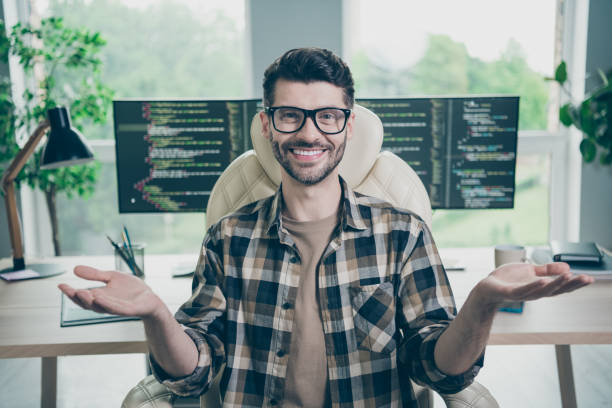 istock Photo of cheerful smiling programmer wear spectacles recording video course modern device indoors workplace workshop home 2174480144
