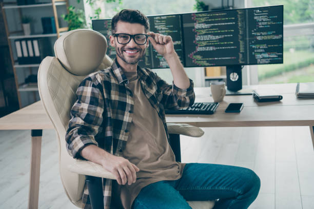 istock Portrait of intelligent pc operator sitting chair hand touch eyewear network security open space indoors 2174480221