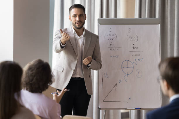 istock Engaged confident handsome business coach giving workshop 2174481517