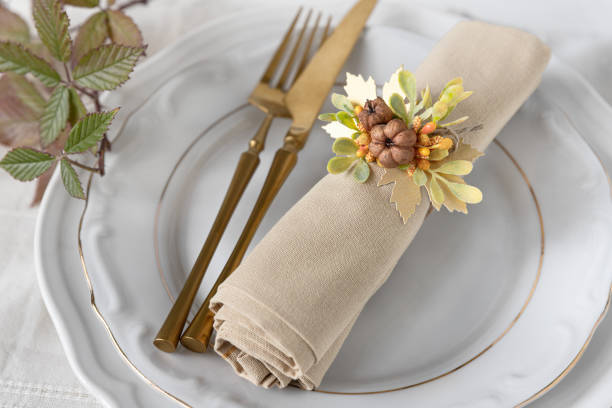 istock Fall napkin decoration on empty plates close up 2174482984