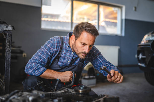 istock Car mechanic inspect car engine with tool at garage 2174483026