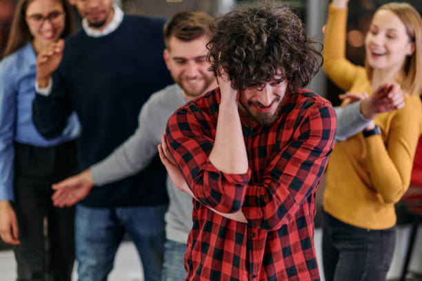istock A group of young business people have fun playing interesting games while taking a break from work in a modern office. Selective focus 2174483036