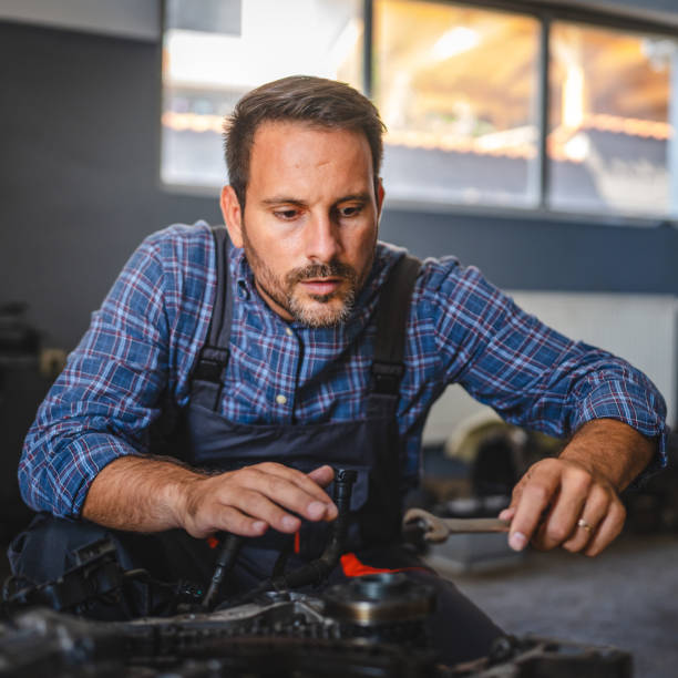 istock Car mechanic inspect car engine with tool at garage 2174483402