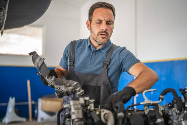 istock Car mechanic work on a car engine in an auto repair workshop 2174484766