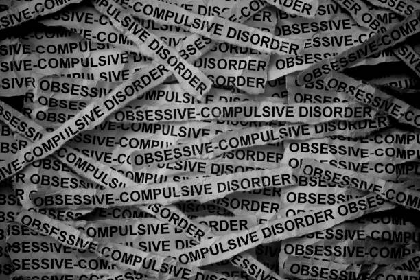 istock Strips of newspaper with the words Obsessive compulsive disorder typed on them. 2174485251