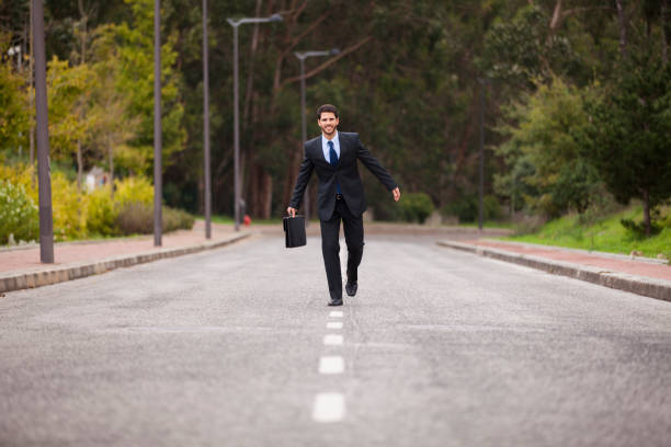 istock Businessman walking on the road line 2174486466