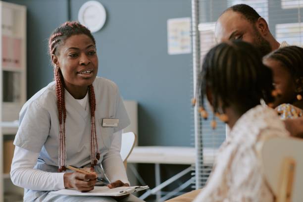 istock Nurse Engaging Family Members During Office Visit 2174486540
