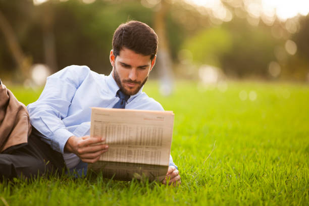 istock Businessman reading the newspaper 2174486576