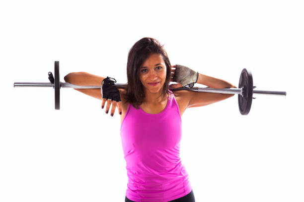 Woman exercising with a barbell weight