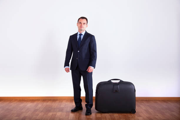 Businessman sit on his luggage