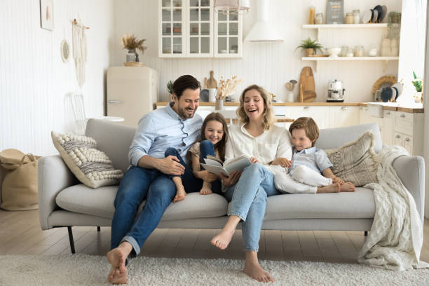 istock Family spend weekend with book at home 2174504791