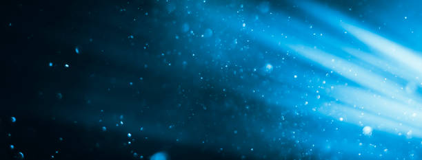 istock beautiful blurred blue background of dust particles and sparkles 2174505795