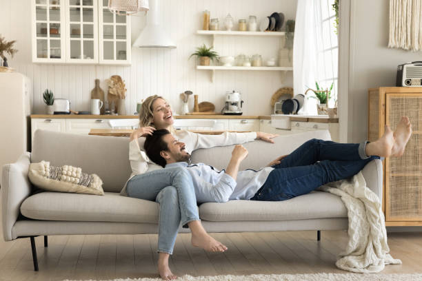 istock Beautiful loving married couple enjoy rest on couch 2174505923