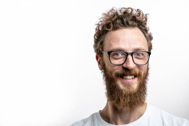 istock Satisfied cheerful handsome man smiles at camera isolated over white background. 2174506800