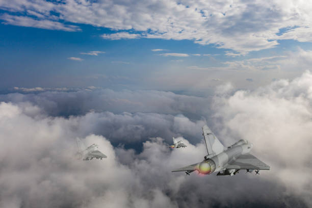 istock Jet aircrafts flying over the clouds. 2174507676