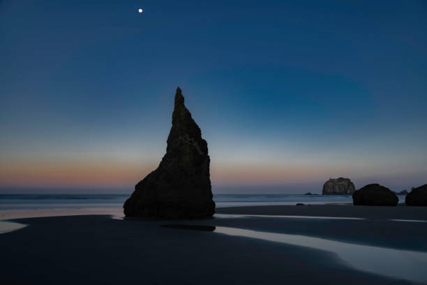 Beach Landscape at Dusk with stars rocky coastline near Gold Beach, Oregon.