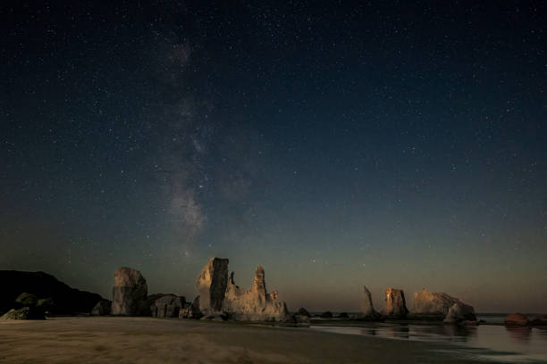 istock Bandon Beach sea stacks under milky way 2174521885