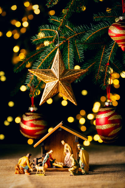 istock Nativity Scene Under Christmas Tree With Red Ornaments 2174525479