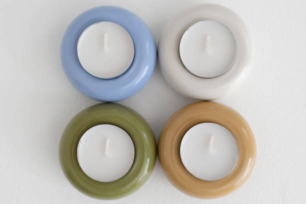 istock Four Colorful Tealight Candle Holders In A Grid 2174530973