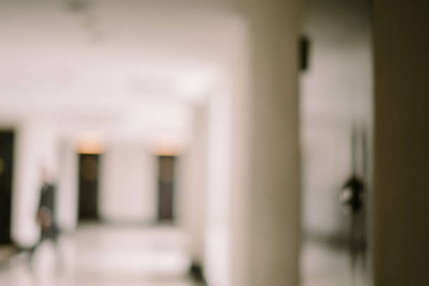 Blurry image of a white-themed hotel room