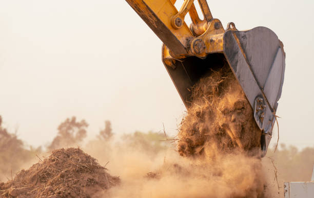 istock Backhoe working by digging soil at construction site bucket of crawler excavator breaking ground for new development project earth moving machine in action. Foundation work on construction project. 2174534590