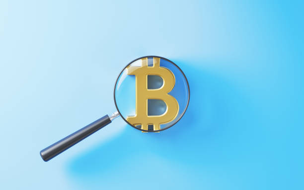 istock Magnifying Glass over Bitcoin Symbol on Blue Background 2174542966