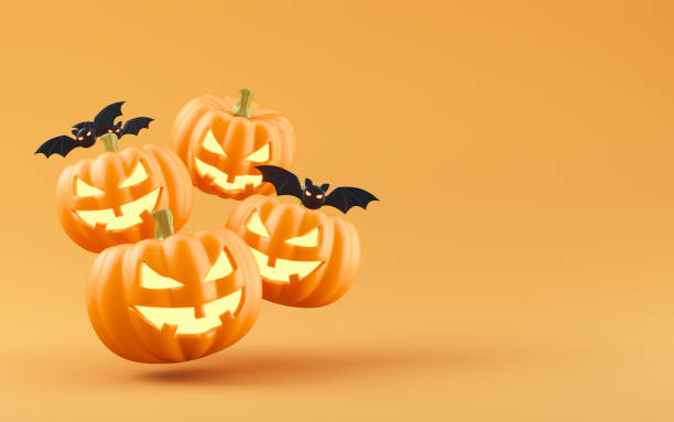 istock Jack-o-Lantern pumpkins and bats on orange background 2174543643