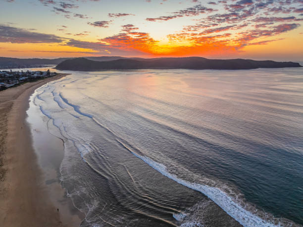 istock Sunrise seascape with pretty clouds in the sky 2174543912