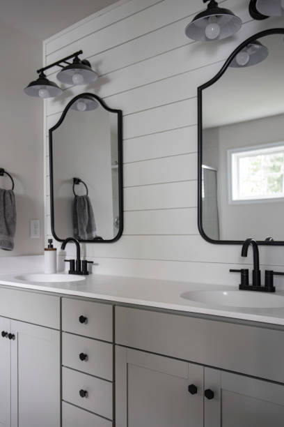 istock Modern Bathroom With Double Vanity, Black Fixtures, Mirrors 2174545100
