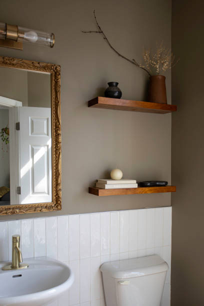 istock Bathroom Sink Area With Floating Shelves And Decor Items 2174545106