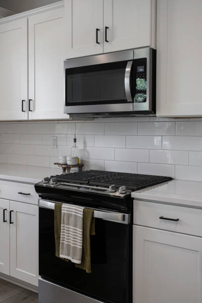 istock Modern Kitchen With Stainless Steel Appliances, White Cabinets 2174545113