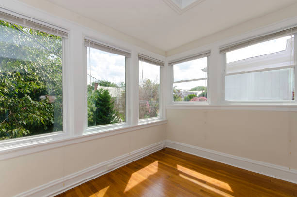 istock Sunroom With Multiple Large Windows And Wood Floor 2174545336