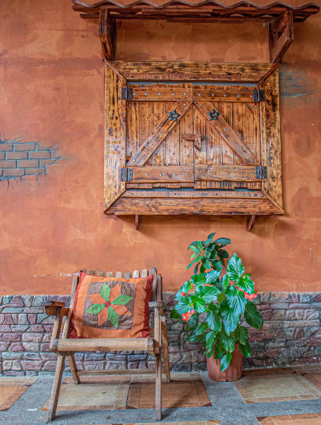 istock A wood chair with a old wall 2174547777