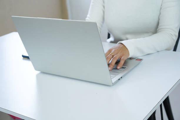 istock Close up of woman's hands typing on a laptop. Working concept 2174550265