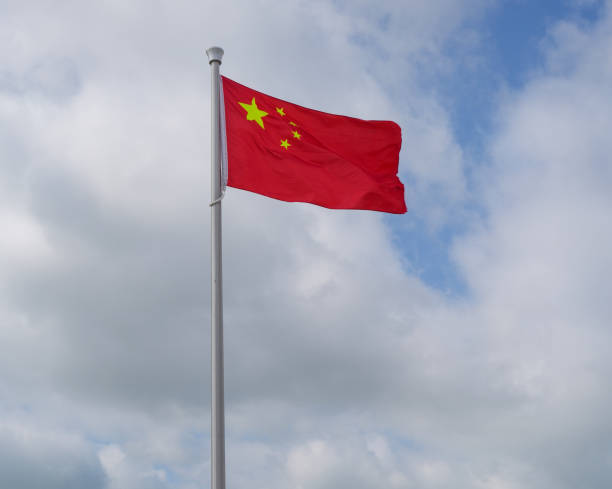 istock China national flag waving on pole 2174552908