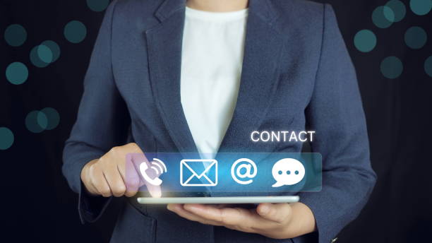 istock Website page contact us or e-mail marketing concept, Customer support hotline Contact us people connection. cube wood with the email, call phone, address, Chat message icons. on keyboard computer. 2174562560