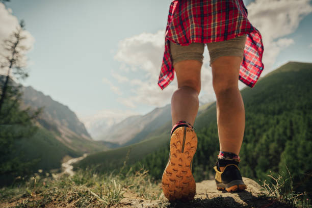 istock womens walk in mountains in summer 2174562773