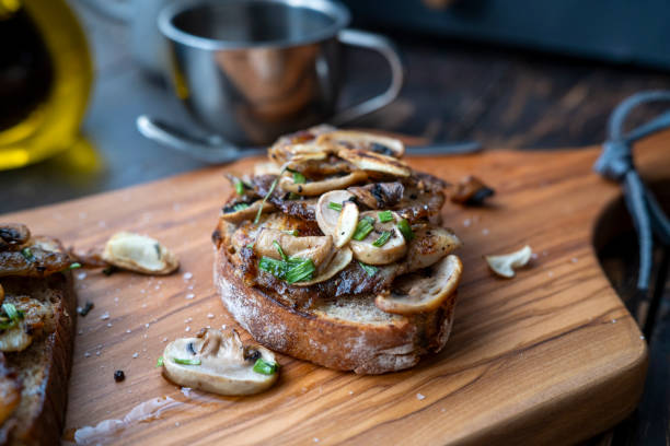 homemade bruschetta, topped with fried mushroom and fillet