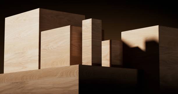 A minimalistic wooden surface featuring clean, geometric cutouts. The smooth, light wood texture and sharp-edged elements create a modern, architectural aesthetic with strong contrasts between light and shadow
