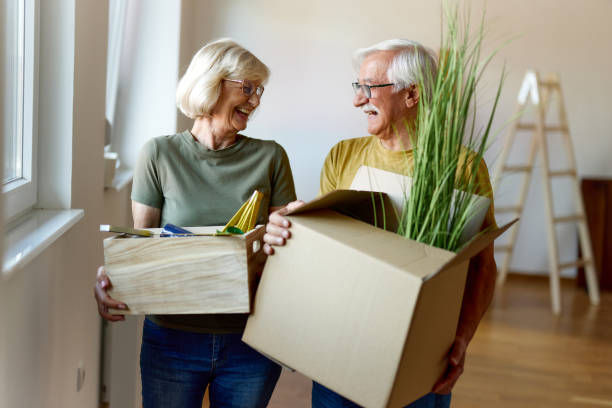 istock Happy senior couple talking while moving into a new home. 2174571301